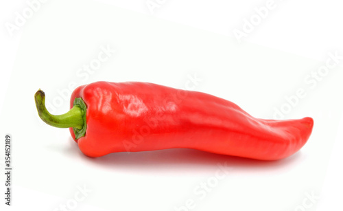 red pointed paprika on white background