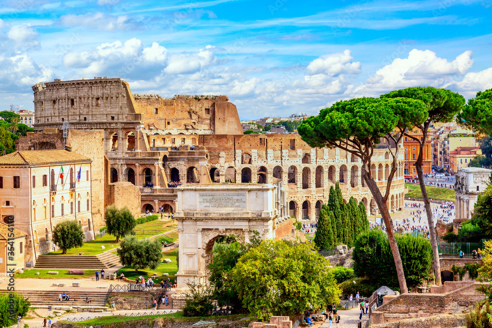 The Colosseum and Arch of Constantine in Rome, Italy during summer sunny day. The world famous colosseum landmark in Rome.