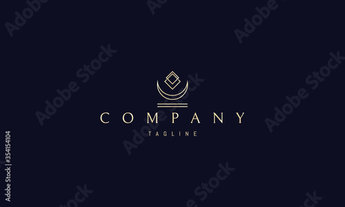 Vector golden logo on which an abstract image of an inverted moon and cubes on it.