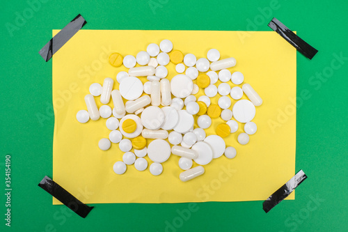 The tablets are on a yellow...