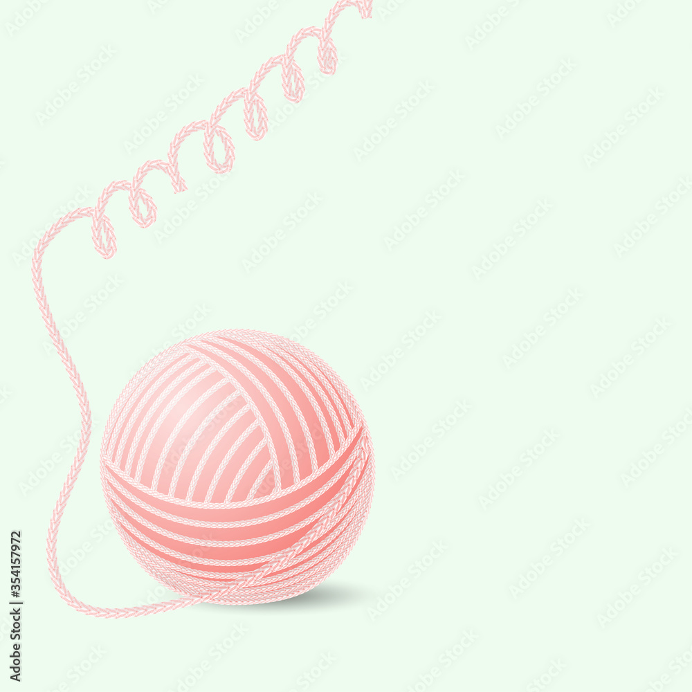 ball of woolen thread on a green background ball of woolen thread on a green background