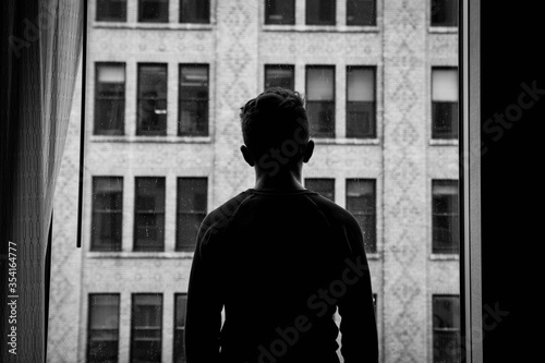 silhouette of a young man