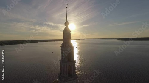 KALYAZIN, RUSSIA-15/08/2019: Fly over the water near the flooded bell tower in the middle of the Volga river in the city of Kalyazin