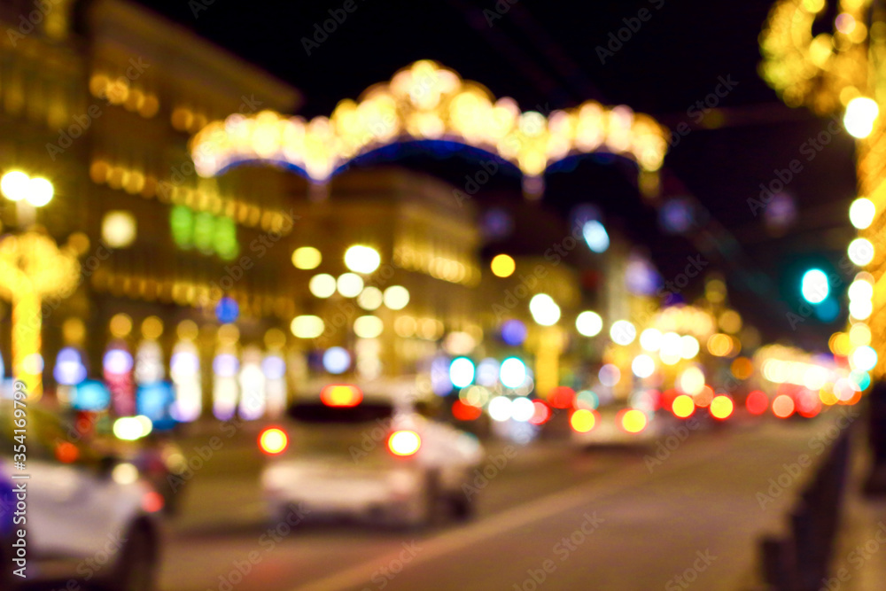 Blurred abstract bokeh background of Saint Petersburg golden lights on Nevsky Prospect in New Year night