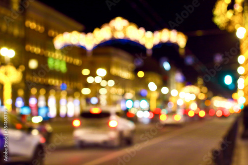 Blurred abstract bokeh background of Saint Petersburg golden lights on Nevsky Prospect in New Year night