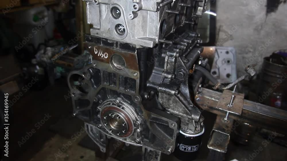 disassembled large diesel in-line diesel engine of an SUV in a garage, repair. disassembled large diesel in-line diesel engine of an SUV in a garage, repair.