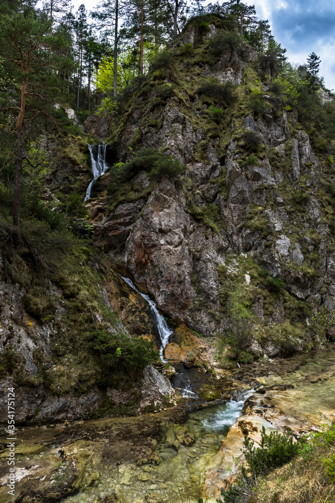 Narrow Waterfall Through Mountain Forest In Austria Narrow Waterfall Through Mountain Forest In Austria