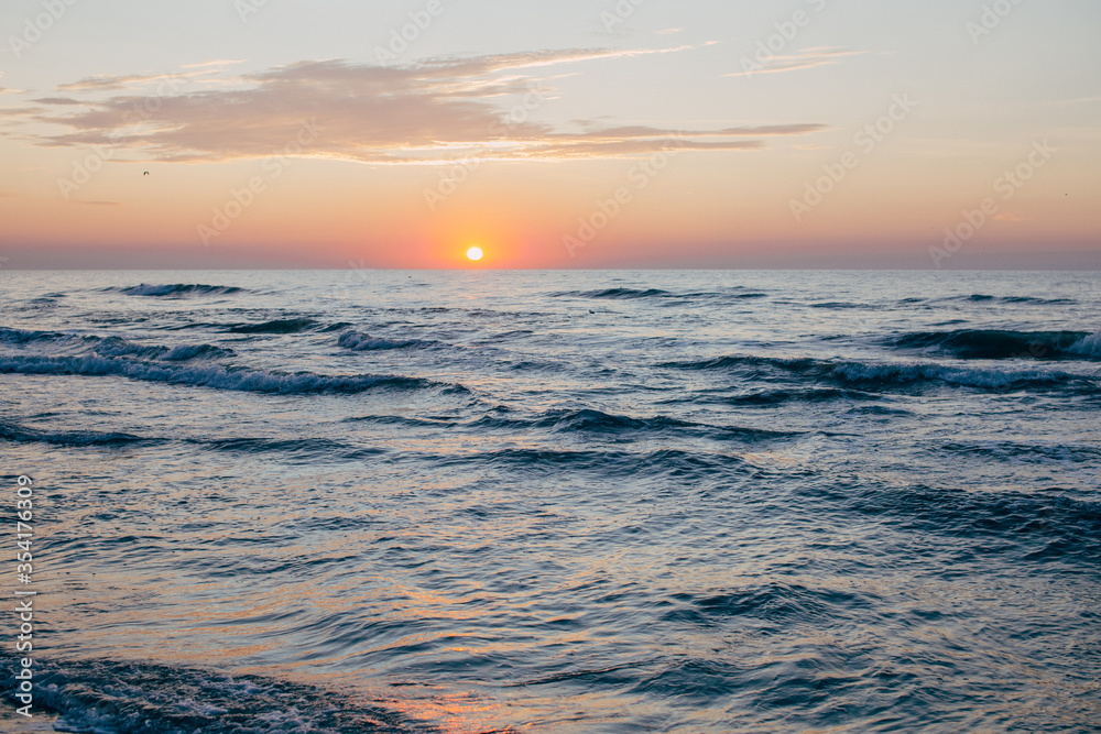 Early morning sunrise over the sea or ocean