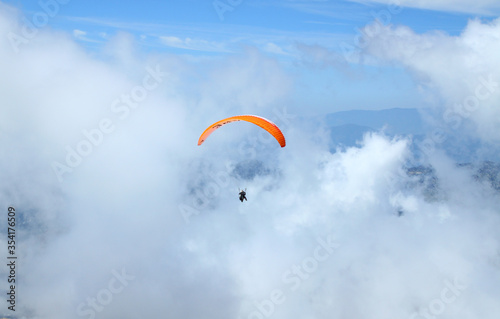paraglider taking off from the mountain