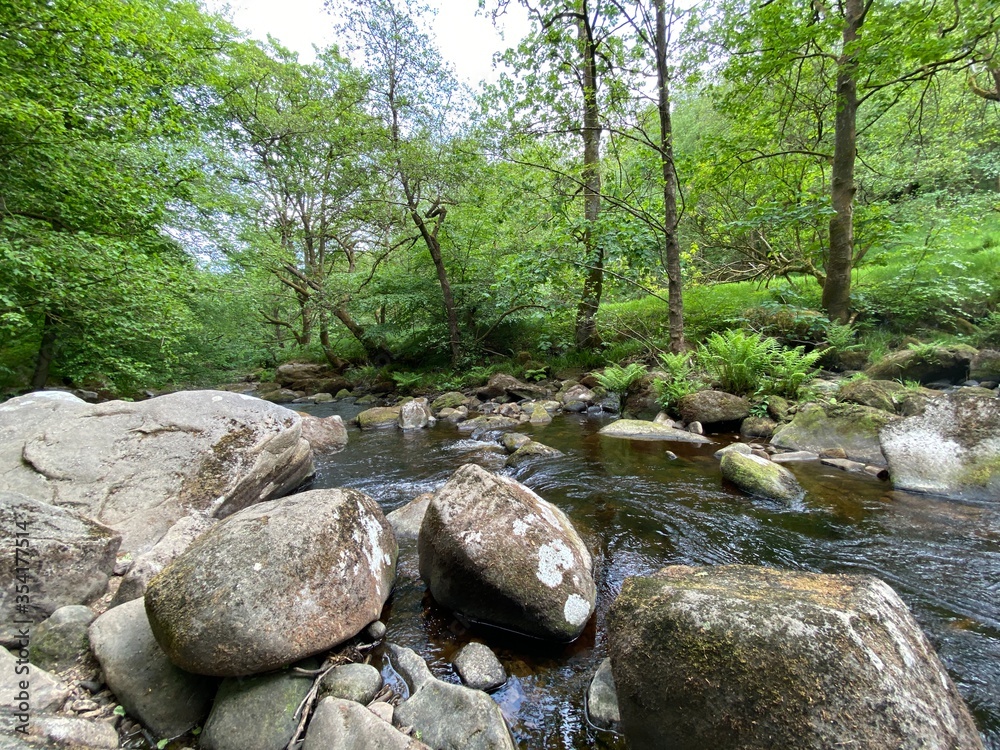 Fast running stream with large rocks in, Hardcastle Crags, Hebden Bridge, Yorkshire Fast running stream with large rocks in, Hardcastle Crags, Hebden Bridge, Yorkshire
