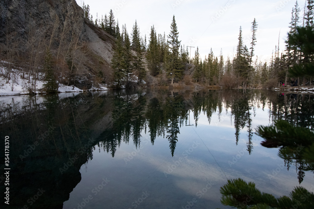 Glassy Lake in the Winter Forest