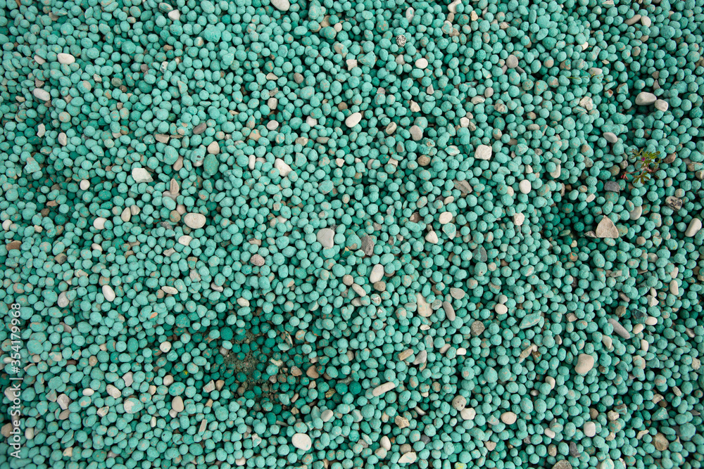 Round green pebbles on the coast. Small colorful round stones of aqua, green and gray colors, texture or abstract background. Round green pebbles on the coast. Small colorful round stones of aqua, green and gray colors, texture or abstract background.