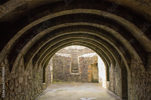 Barrel-Vaulted Basement of Crookston Castle in the Pollock Area in Glasgow  Scotland. Photo Showing Cellar Style Arch Ceiling and Stone Walls. Free Entry to the Publick