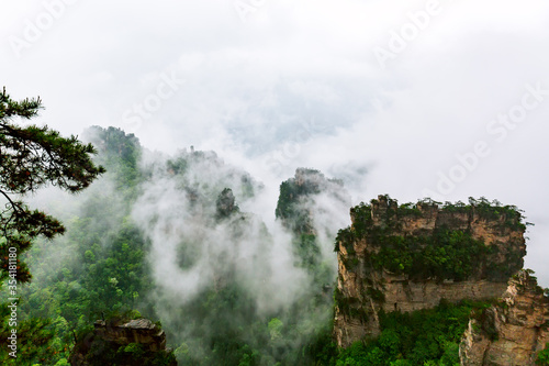 Zhangjiajie National park. Famous tourist attraction in Wulingyuan  Hunan  China. Amazing natural landscape with stone pillars quartz mountains in fog and clouds
