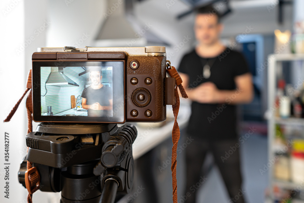 Food blogger blogger is recording tutorial online in front of camera. Welness coach. vlog video live streaming at home Food blogger blogger is recording tutorial online in front of camera. Welness coach. vlog video live streaming at home