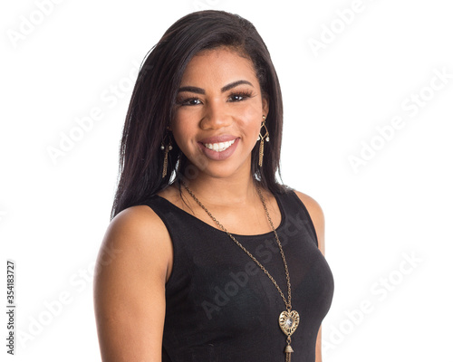 portrait of Black brazilian woman with a long straight hair looking at camera with joyful smile. Isolated on white background. photo