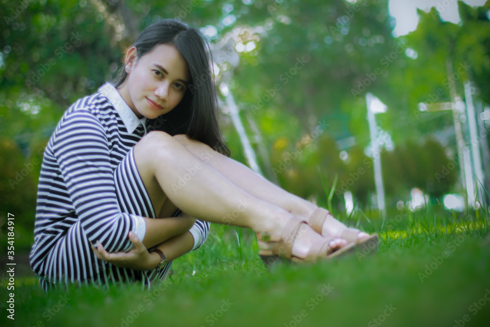 Lady in the park with casual dress Lady in the park with casual dress