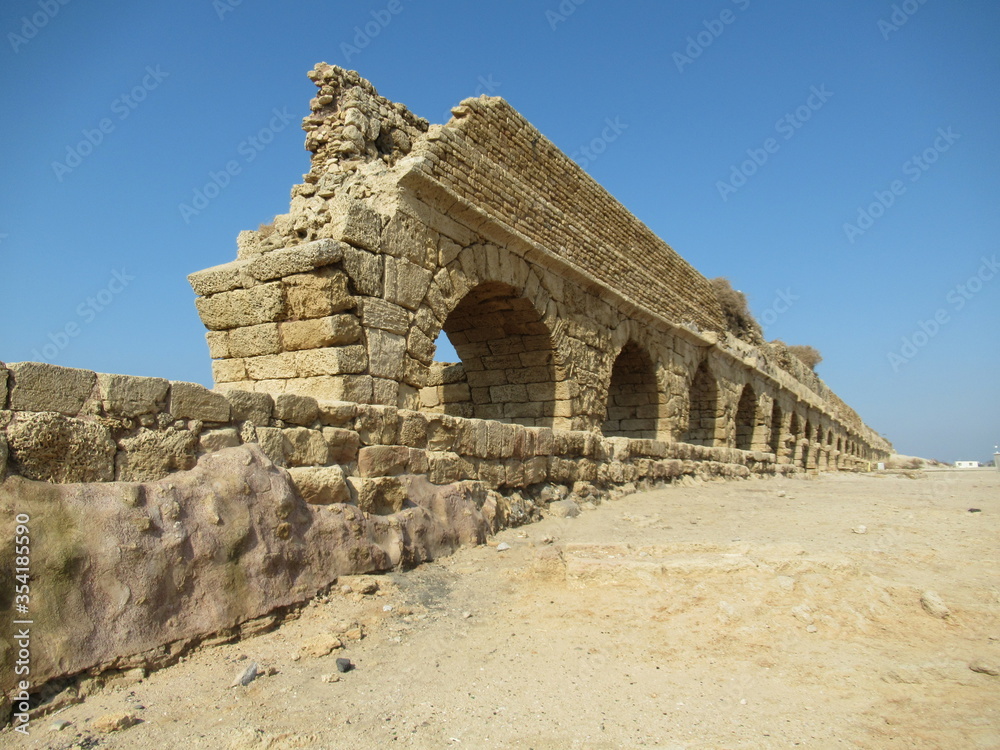 View of ancient Roman aquaducts in Caesarea, Israel
