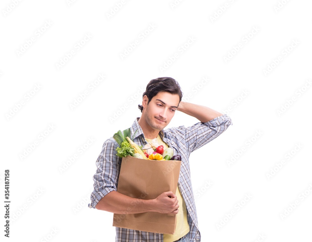 Young man with his grocery shopping on white Young man with his grocery shopping on white