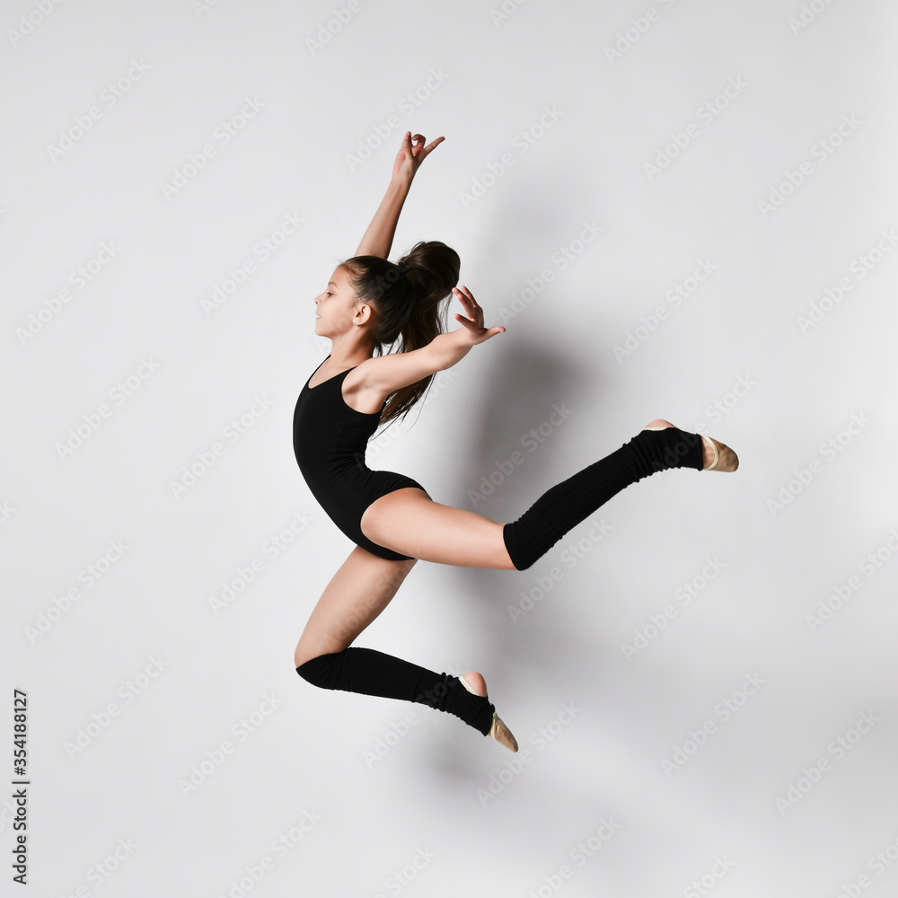 Teenage girl gymnast with pigtail, in black leotard, knee