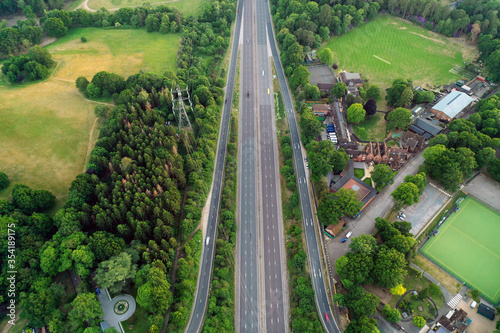 Motorway sceen goes through countryy side green photo