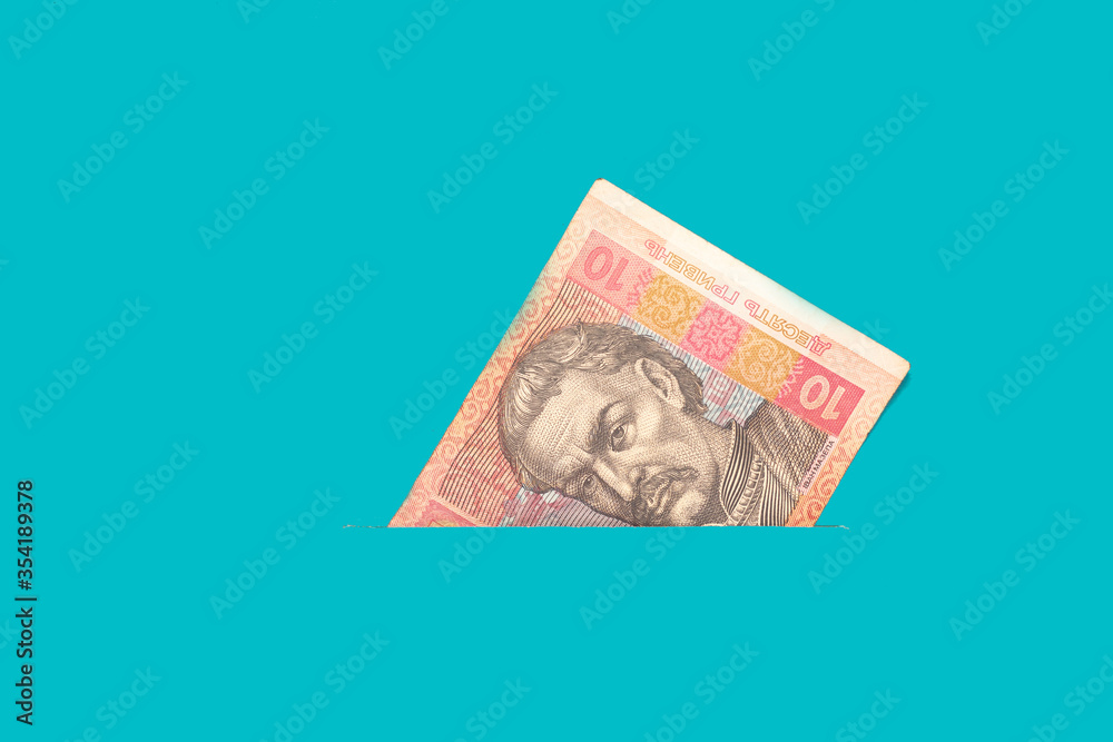 Banknote ten hryvnia in your pocket. Money close up. Abstraction Banknote ten hryvnia in your pocket. Money close up. Abstraction