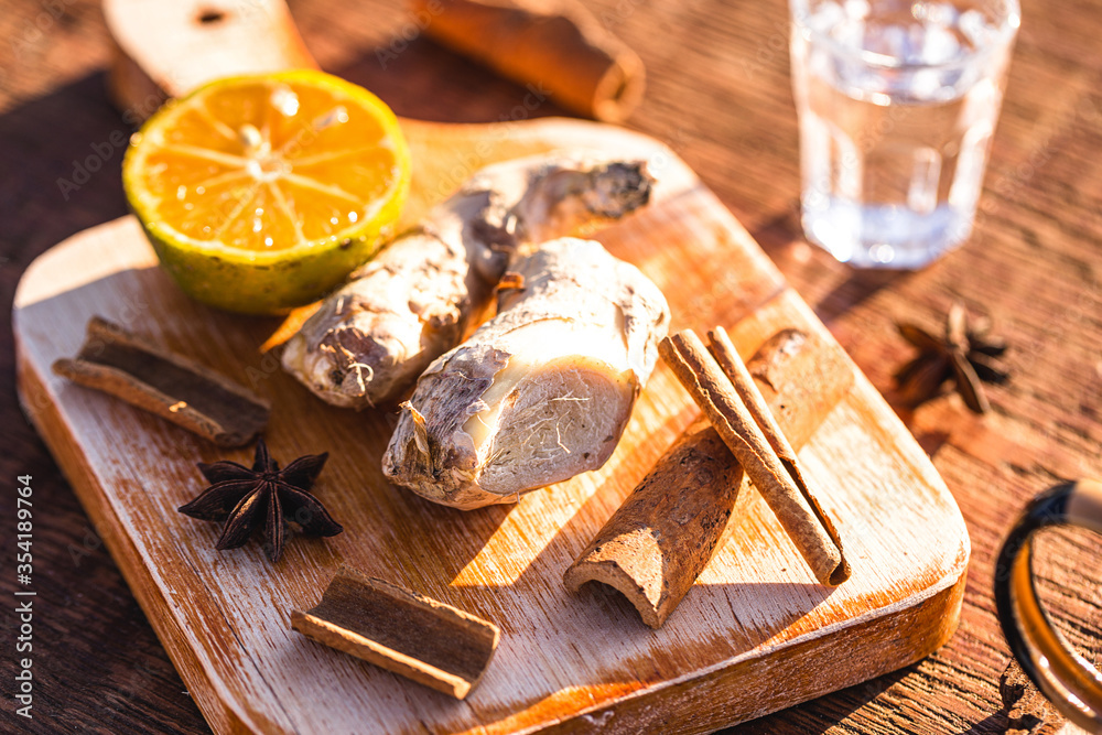 ingredients used to make winter drink, ginger, lemon, cloves, cinnamon sticks or anise. Ingredients for a Brazilian drink called ingredients used to make winter drink, ginger, lemon, cloves, cinnamon sticks or anise. Ingredients for a Brazilian drink called