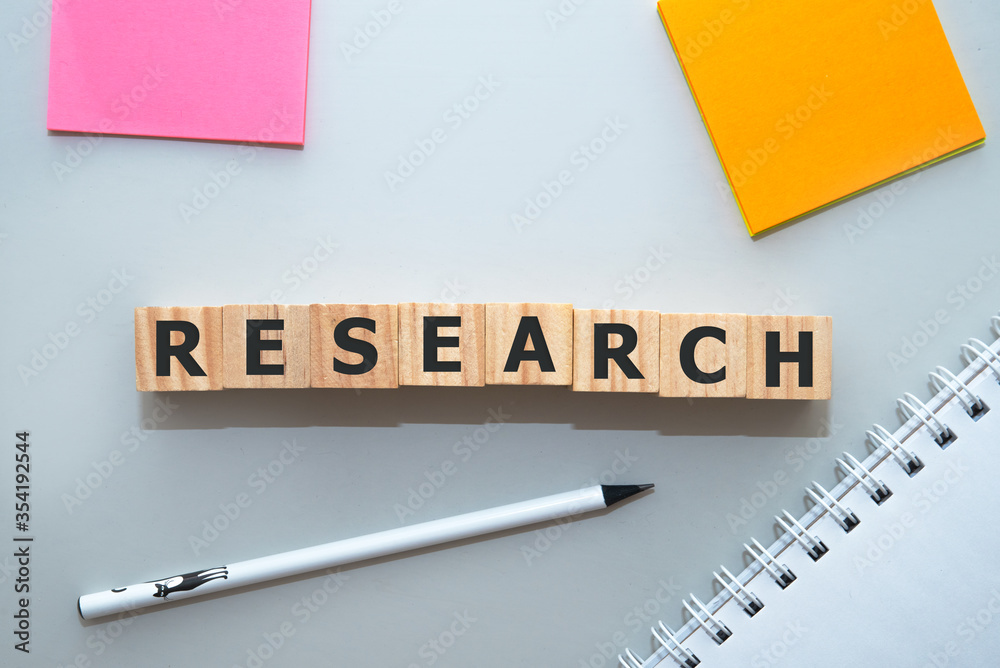 RESEARCH word made with building blocks on office table. RESEARCH word made with building blocks on office table.
