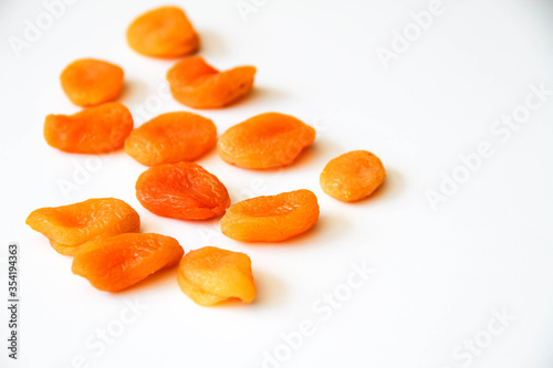 Dried apricots on a white background. Back view.