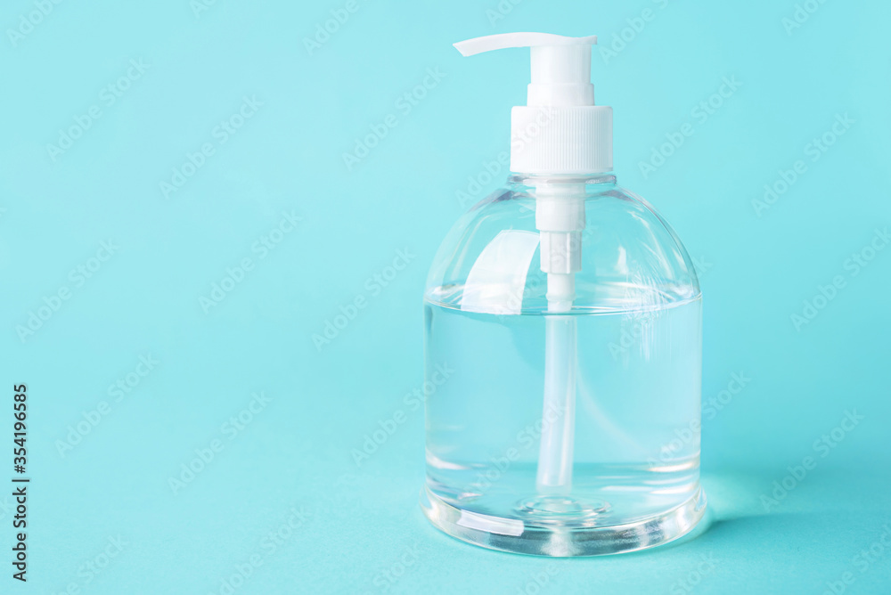 bottle alcohol clean with sanitiser liquid bottle . concenpt protection sanitiser tool protect corona virus on turqouise isolated background bottle alcohol clean with sanitiser liquid bottle . concenpt protection sanitiser tool protect corona virus on turqouise isolated background