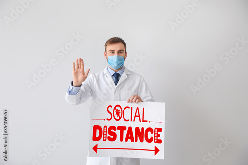 Young doctor holding paper ...