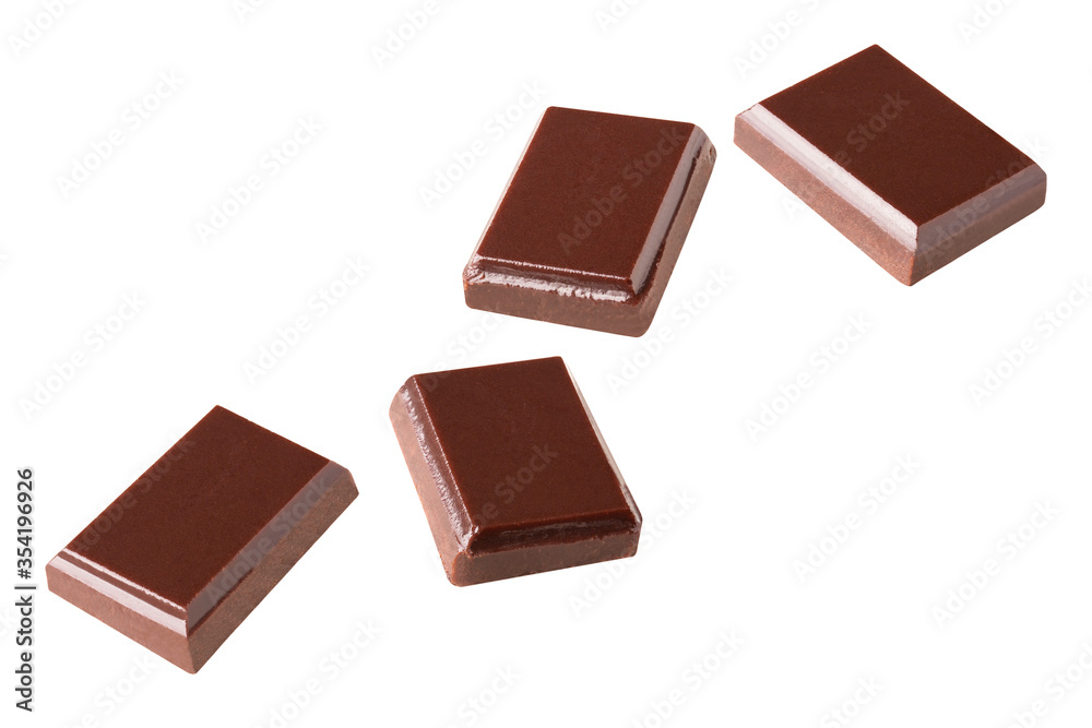 chocolate flying pieces in the air on a white background collection .Clipping path. chocolate flying pieces in the air on a white background collection .Clipping path.