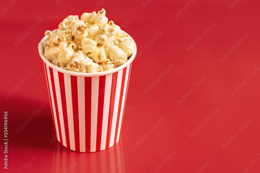 popcorn blast cinema box with corn bucket on red isolated