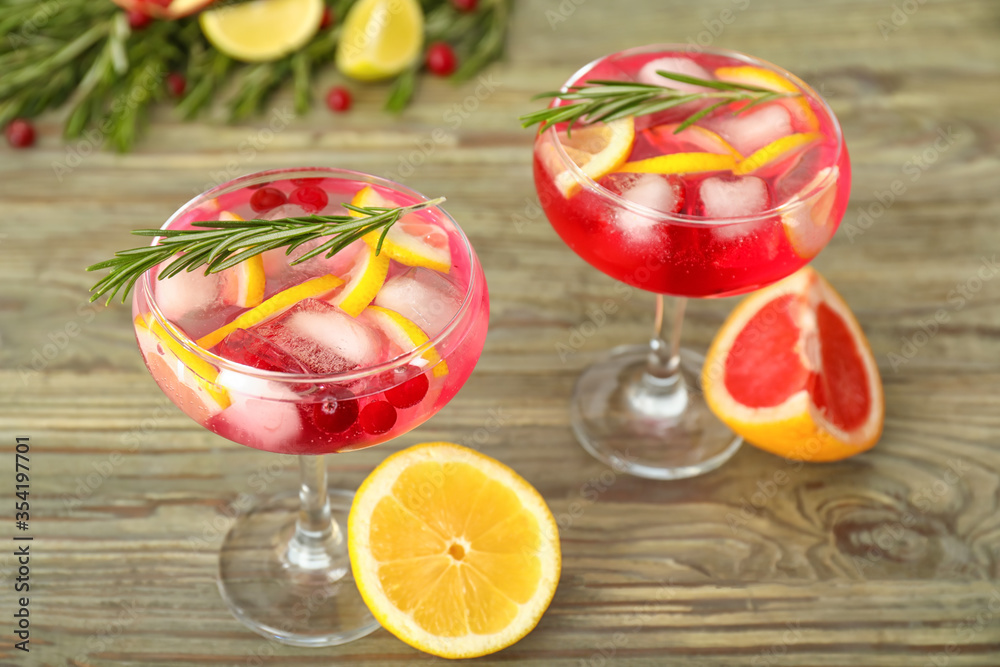 Glasses of healthy cocktail on wooden background