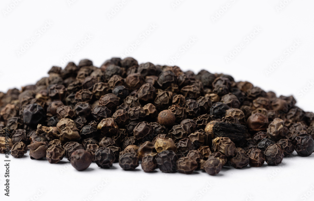 Black pepper on white background.
Spices. Black pepper on white background.
Spices.