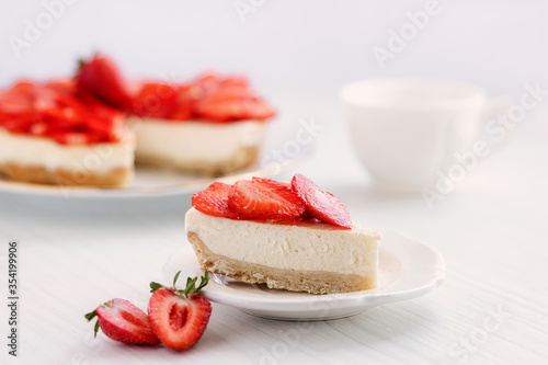 Strawberry Cheesecake on a white table.