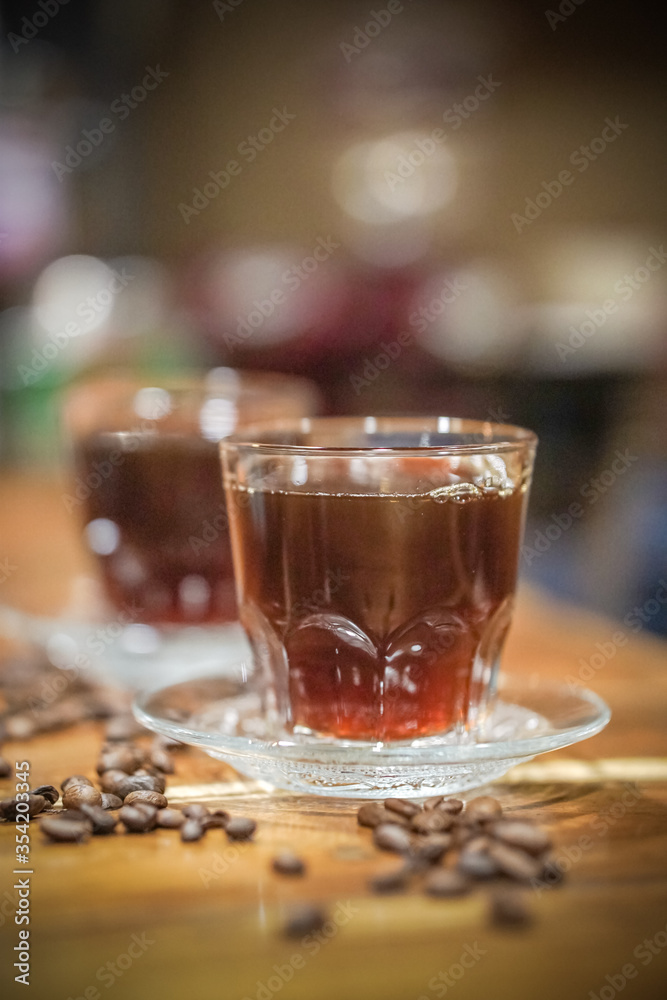 two glass cup of coffee and beans two glass cup of coffee and beans