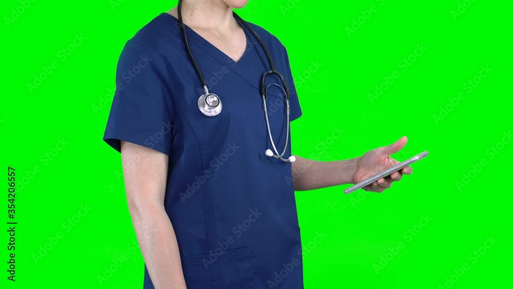 4K female nurse doctor on green screen isolated with chroma key. Woman standing using smartphone. Side view
4K female nurse doctor on green screen isolated with chroma key. Woman standing using smartphone. Side view