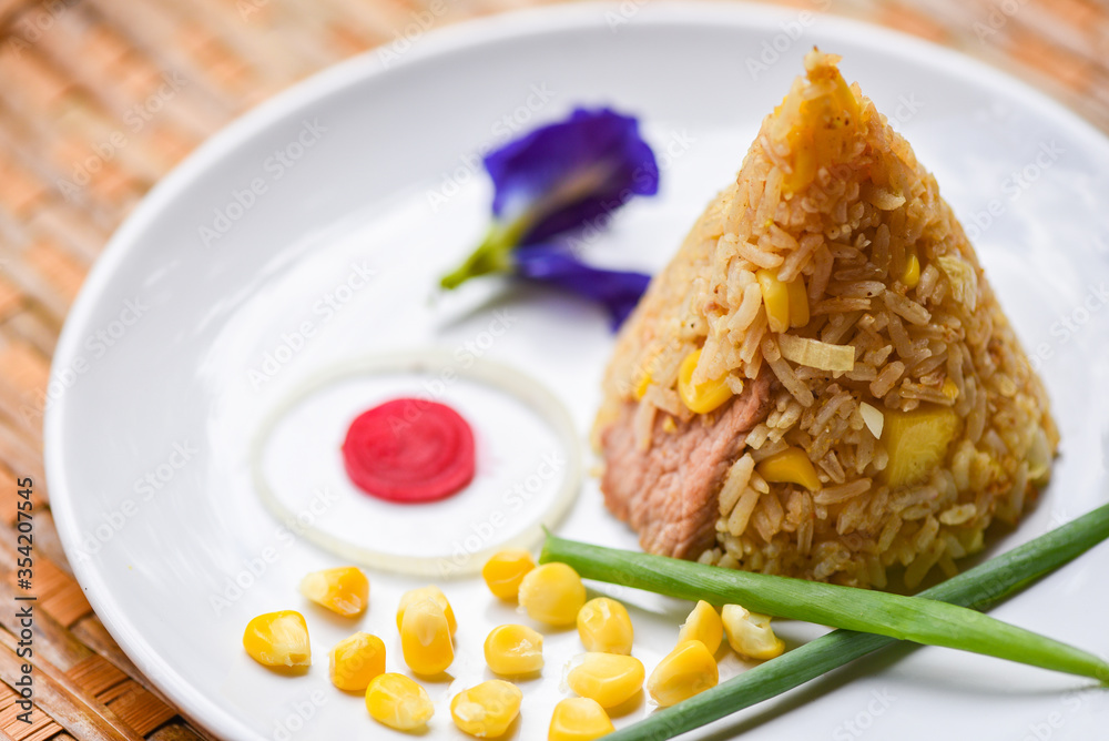 fried rice corn on white plate asian food in thai / fried rice corn on white plate asian food in thai /