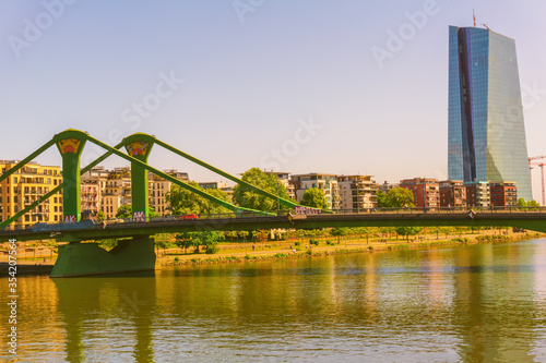 FRANKFURT,GERMANY - MAY 16,2020:Floesserbridge This is the sunny view to the big European Central Bank near the Main.