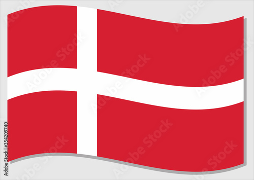 Waving flag of Denmark vector graphic. Waving Danish flag illustration. Denmark country flag wavin in the wind is a symbol of freedom and independence.