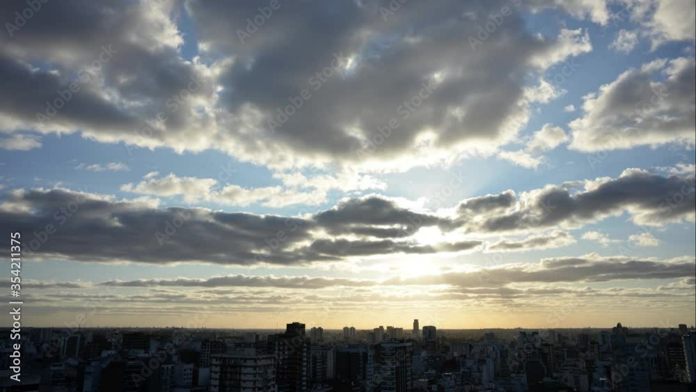 time lapse of moving flat clouds drifting over big city Buenos Aires at sunset time lapse of moving flat clouds drifting over big city Buenos Aires at sunset