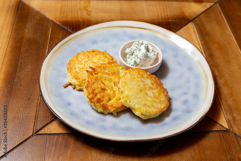 Potato pancakes in a plate, lunch at home or in a cafe