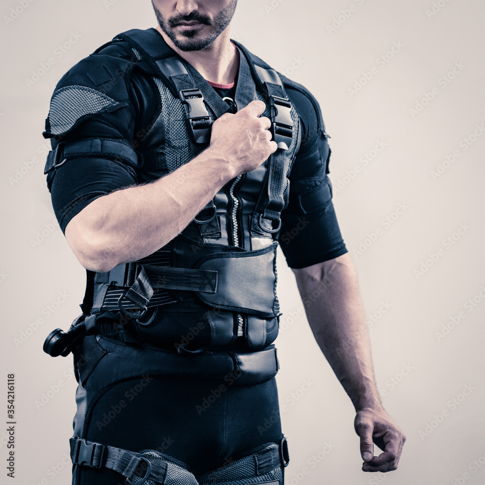 close up of young fit athletic man wearing EMS costume close up of young fit athletic man wearing EMS costume