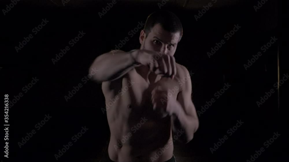 boxer throwing punches at camera. Close up. boxer throwing punches at camera. Close up.