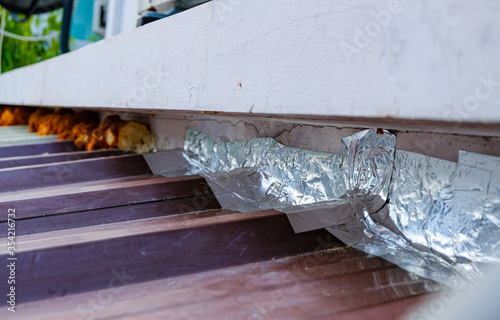 Roof repairing by using aluminum foil tape to prevent water leak before rainy season