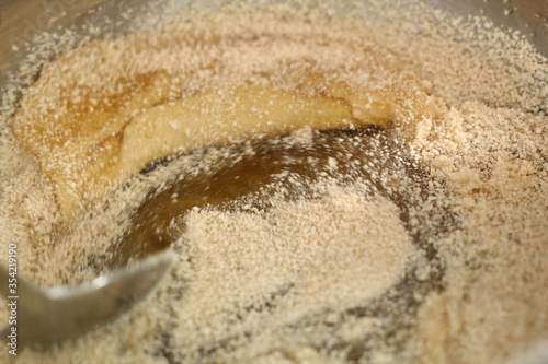 Stir white breadcrumbs with golden syrup. Making Shoofly Tart Series. photo