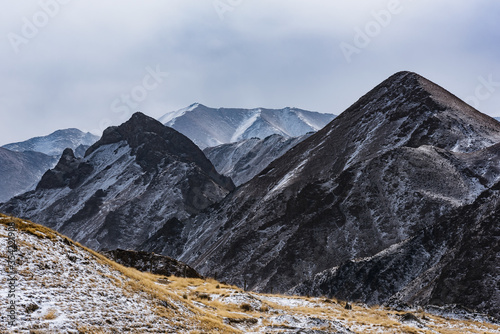 lanscape with barren mountain which is covered with ice