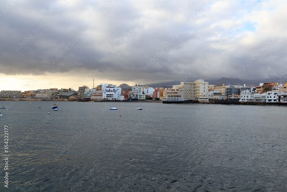 El Medano panorama with hotels, Atlantic Ocean and dark clouds on Canary Island Tenerife, Spain