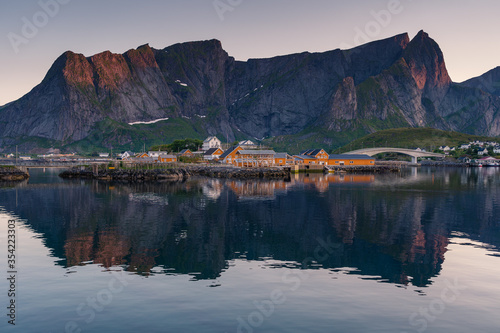 Sakrisoy village in summer season in midnight with reflection, Lofoten island in Nordland, Norway, Scandinavia